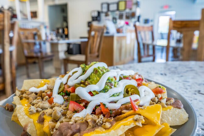 Taqueria Tecoman is the only Mexican restaurant serving large plates of nachos in Humboldt Hill.