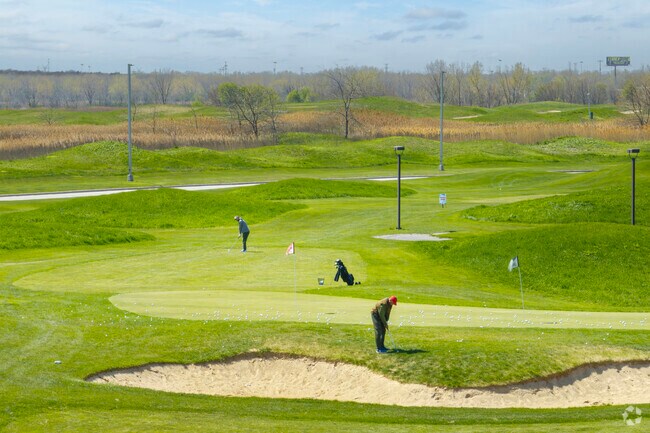 Roseland golfers practice their chip shots on the greens of Harborside International.