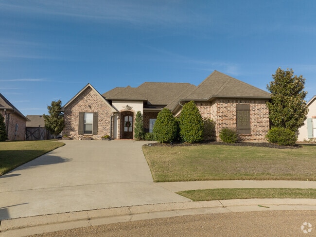 Homes in Flowood feature diverse architecture, including traditional brick exteriors.