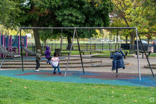 Children enjoy the swings at Luke Easter Park.