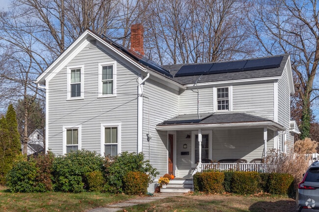 A farmhouse-style home from the past Century has modern solar panels in Florence.