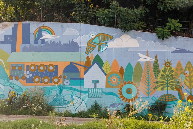 A bright mural lines a street in Old Third Ward.