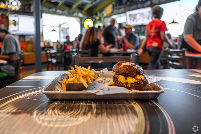 Grab a bite to eat at Sickies Garage near Avalon Park.