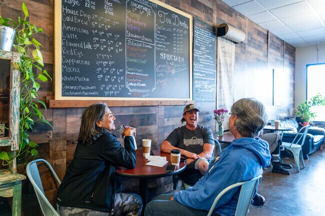 Friends enjoying their coffee and conversation at Perkin' Up in Acton.