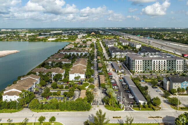 Fern Crest Village features modern apartment complexes and lush green spaces.