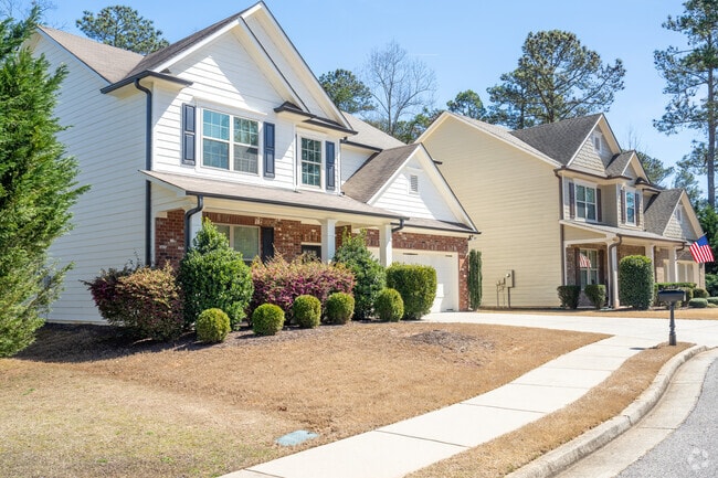 Newer subdivisions in Sugar Hill feature simple landscaping.