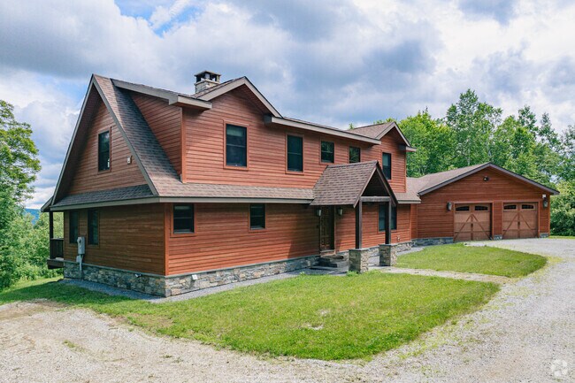 Locals can find large log cabins with a chalet style architecture as they make their way up the mountains from Mendon.