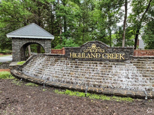 The entrance to Highland Creek greets you with an impressive fountain and brickwork.