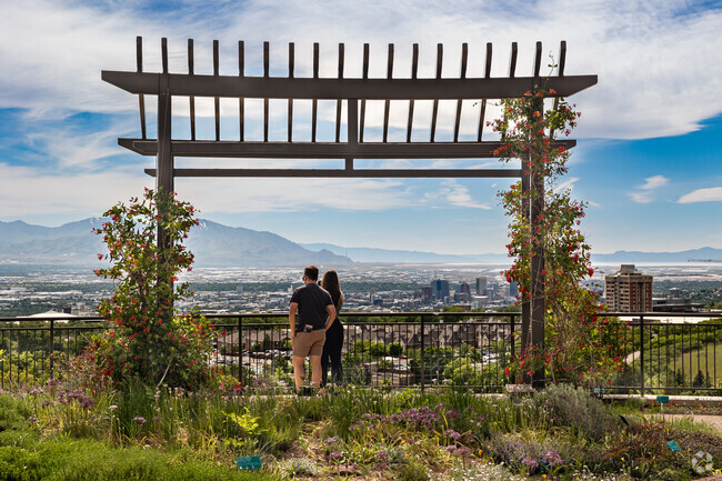 A couple enjoys a fantastic view of the Salt Lake Valley from Red Butte Garden in University.