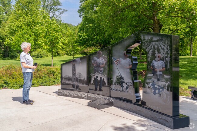 An East Highland resident admires the memorial in Veterans Park at 303 E Gartner Rd, Naperville.