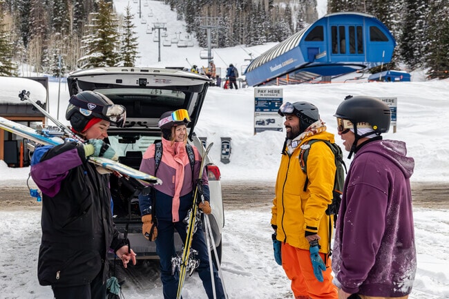 Skiers enjoy conversation at Solitude Mountain Resort near Cottonwood Heights.