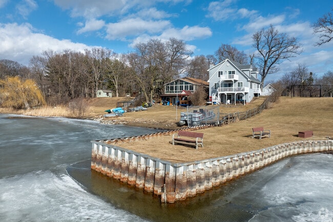Popular Colonial Revival styles in Lindenhurst are seated on large wooded lakeside lots.