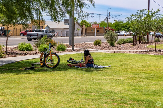 Visitors enjoy the shaded walking paths and picnic areas at Old Town’s Dessie Lorenz Plaza.