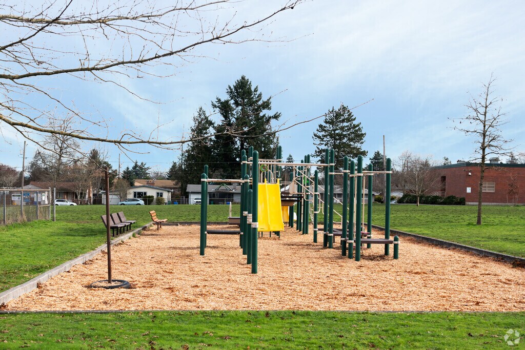 Play ground and grassy area on the back of campus.