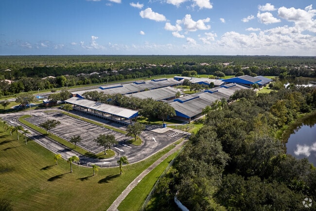 Palm trees sway as students head to class at Sea Wind Elementary School.