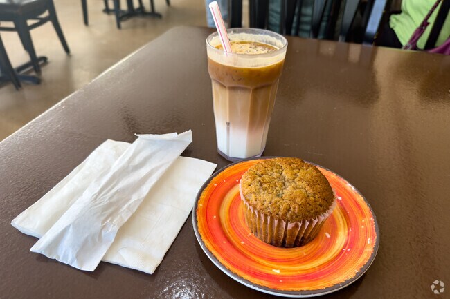 Enjoy a coffee and muffin at Village Cafe in Victoria Park.