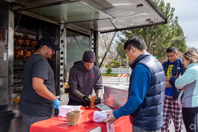 Downtown Pleasanton Farmer's Market featured food trucks include Roli Roti.