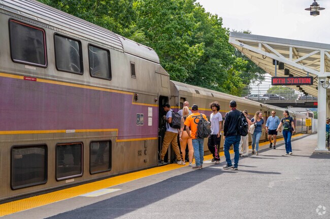Commuters board the MBTA commuter train at Lawrence Station near Prospect Hill-Back Bay.