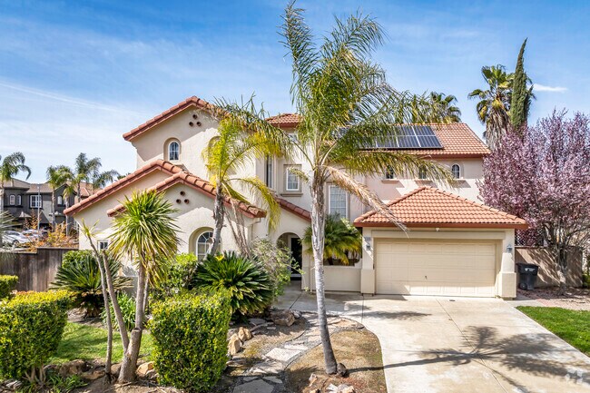 Larger Spanish-style homes with tile roofs dot the community of Gateway West.