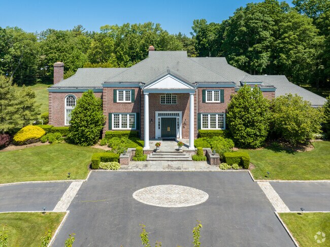 New homes in Old Brookville feature classical design elements and long private driveways.