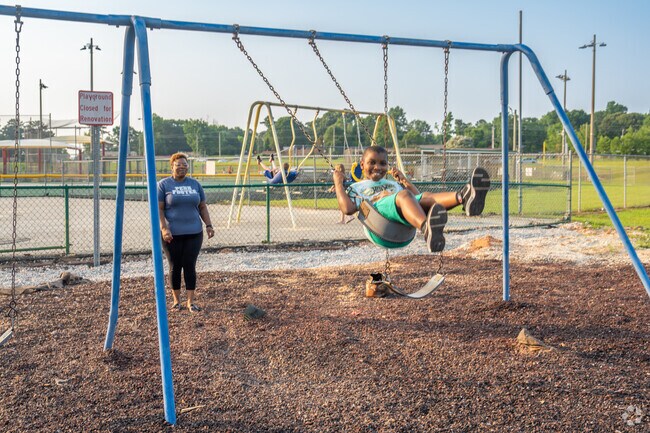Make family memories on the playground at West Ridge Park near Stephens Woods.