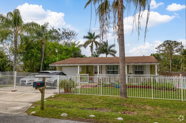 Ranch home at the end of the cul de sac offers a slightly larger lot in Greenacres.