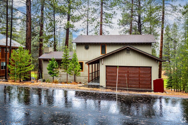 Single‑family homes sit among tall pines across Joerger Ranch.