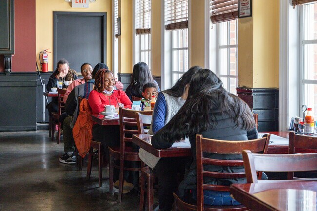 Dining at Benjamin Benson's famous Dame's Chicken & Waffles.