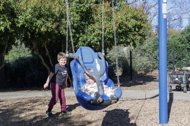 Swinging joy Children at Arbolado Park, Northgate.