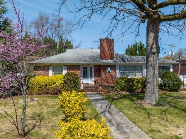 Brick ranch homes sit in beautiful yards in Liberty.