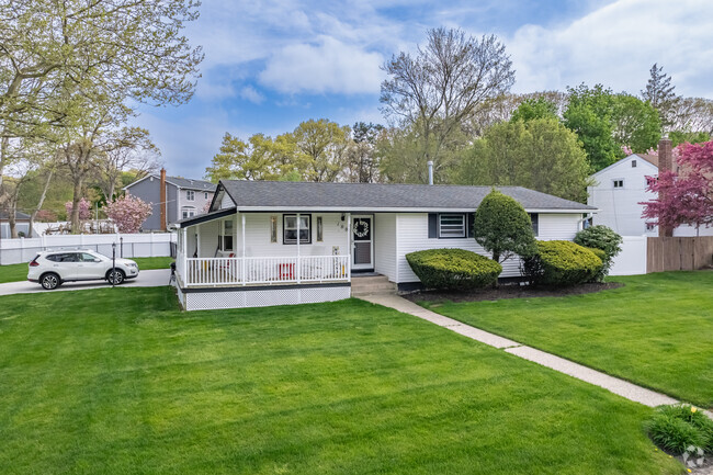 This quaint ranch in Selden has a beautiful wraparound porch.