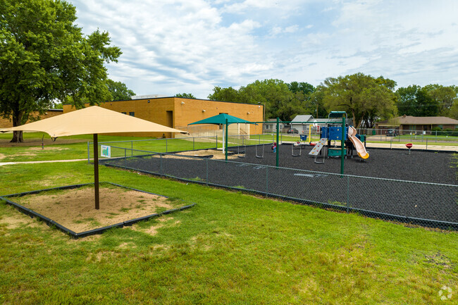 There are several umbrellas for shading in the outdoors at Vermillion Elementary School.