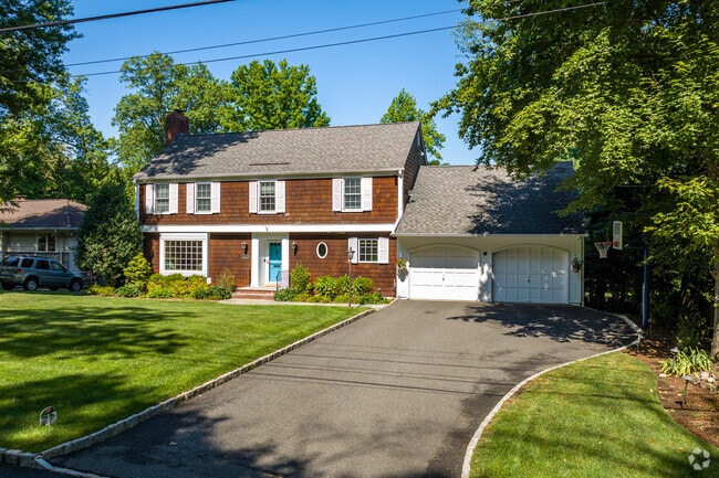 Many of Verona's homes are set on large lots with surrounding yard areas, such as this colonial.