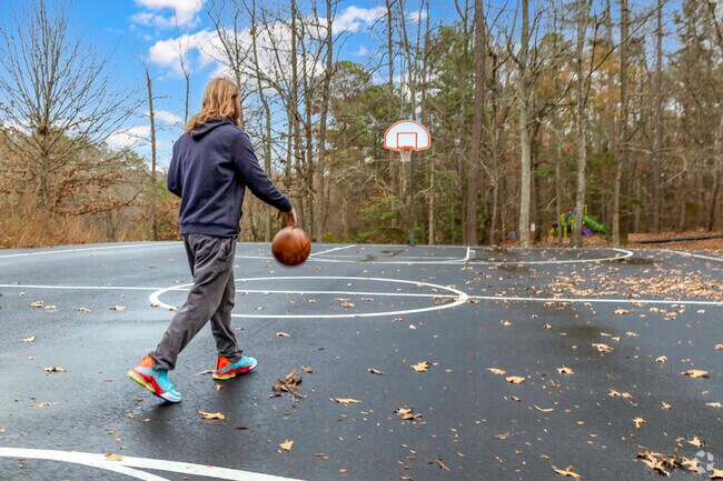 A local enjoying the basketball court at Deep Run Park in Tuckahoe Village, Virginia.