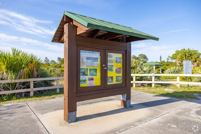 Highlands Scrub Natural Area entrance with information board in Highlands neighborhood