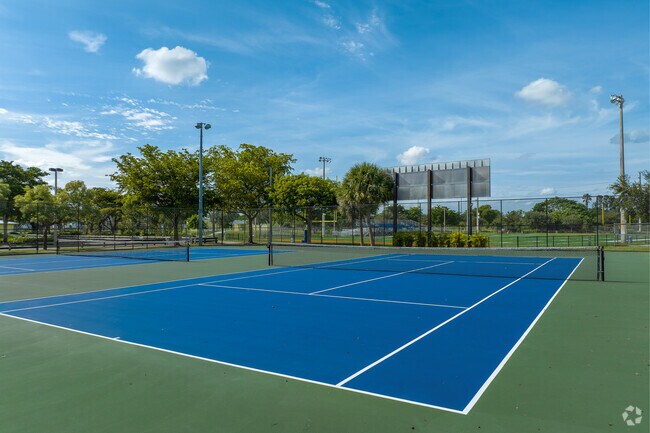 Residents enjoy the tennis courts at Gwen Cherry Park in Gladeview.