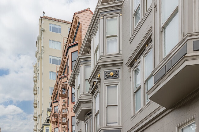 Apartment widows protrude out over a Cow Hollow street.