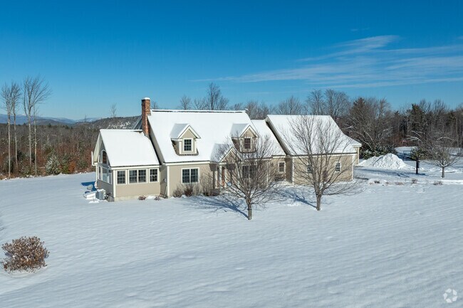 This Cape Cod in Brownfield offers stunning views of the surrounding mountains, providing a picturesque and tranquil living experience.