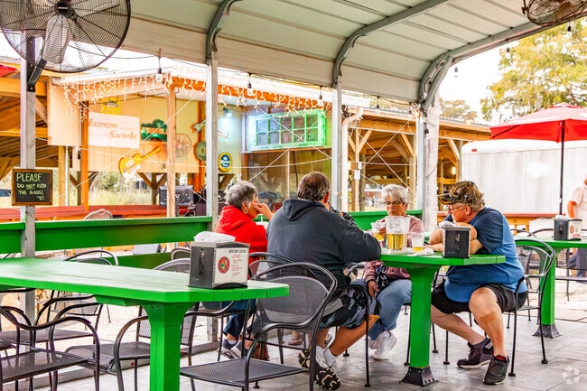 People eating at Gator Bat Marina Bar and Grill in Lake Yale before the live music starts.
