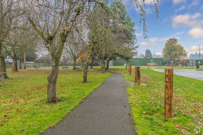 Tree-lined walking trails at Barendse Park in Hubbard, OR.