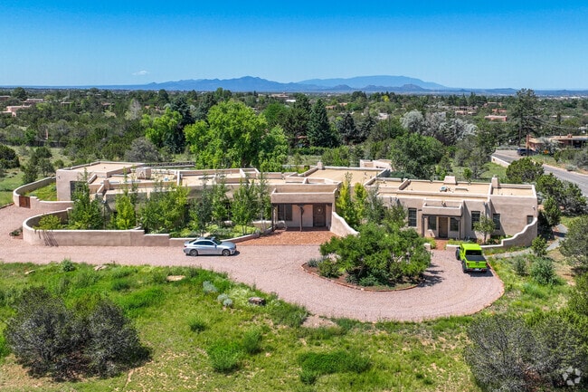 This Santa Fe style home can be seen with the Sandia Mountains near Albuquerque in the distance.