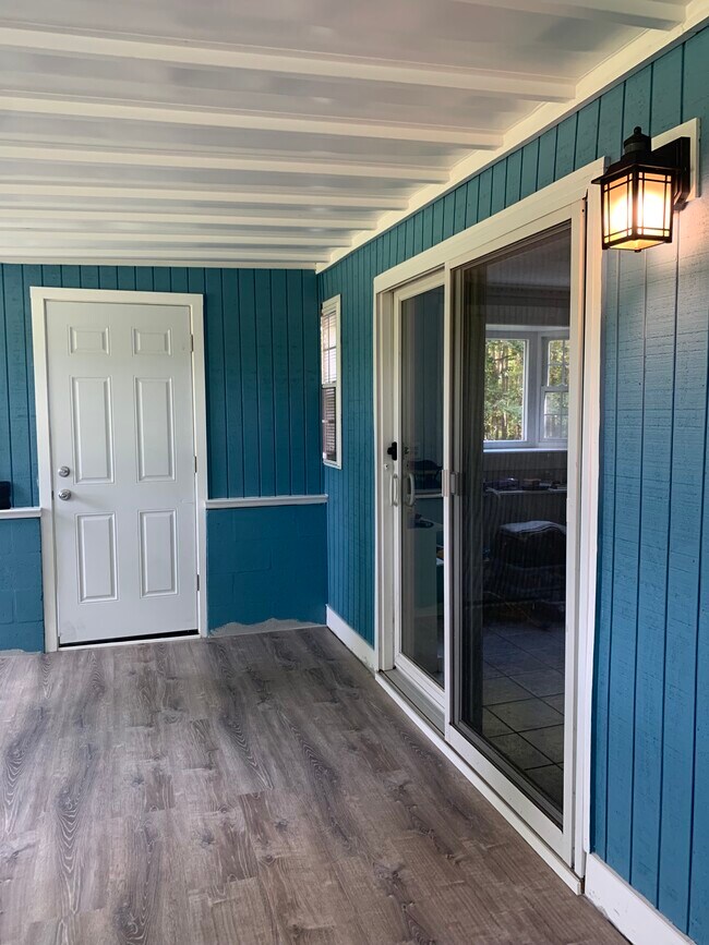 Enclosed porch entrance through sliding door