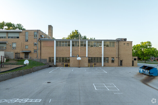 Danforth Elementary has a basketball court behind the main building.