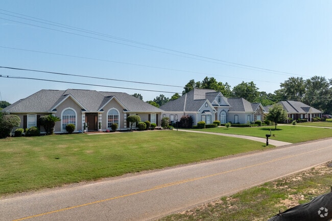 Craftsman-style homes line the roadways with peaked gables and manicured lawns.