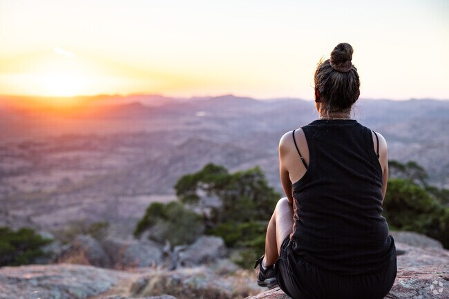Watch the sunset in the Wichita Mountains near Pecan Valley.