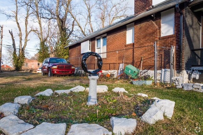 A unique sculpture adorns the front yard of a Wells-Goodfellow home.
