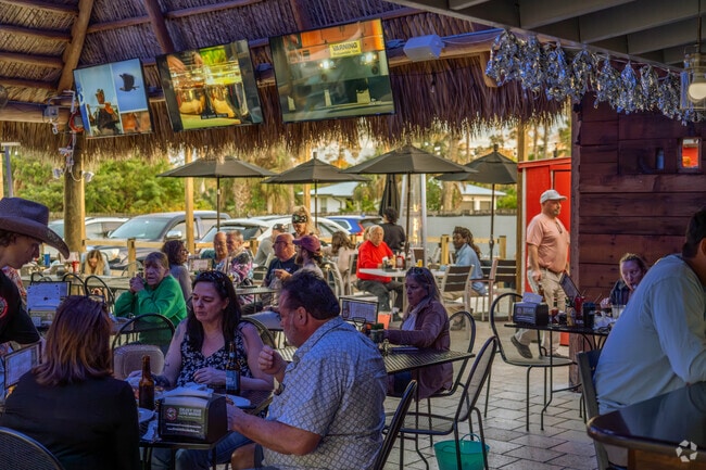 The patio at Cracklin' Jack's on Collier Blvd is a popular place for a bite and a drink.