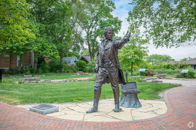 Joseph Naper's statue, east of Brush Hill, was founded in Naperville in 1831.