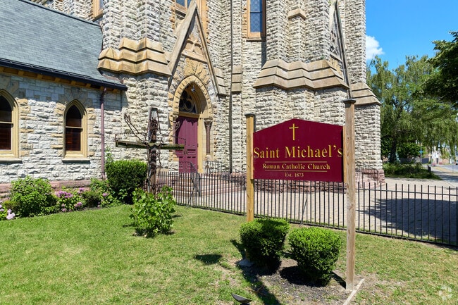St. Michael’s Church holds Catholic Mass in a 19th-century Gothic Revival-style building.