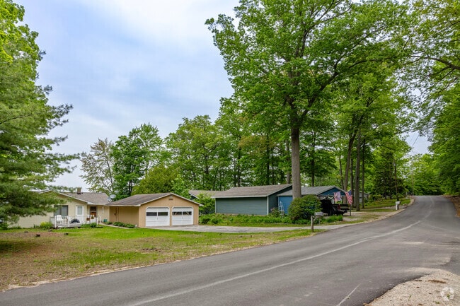 A rolling shoreline is lined with rows of lake homes throughout Maple Grove.